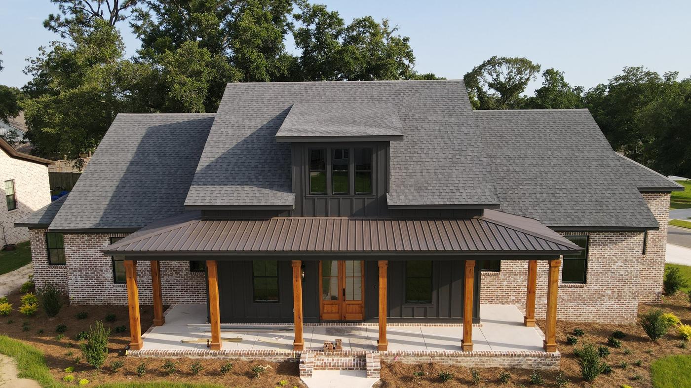 New shingle roof with metal porch roof on a home in Destin, FL